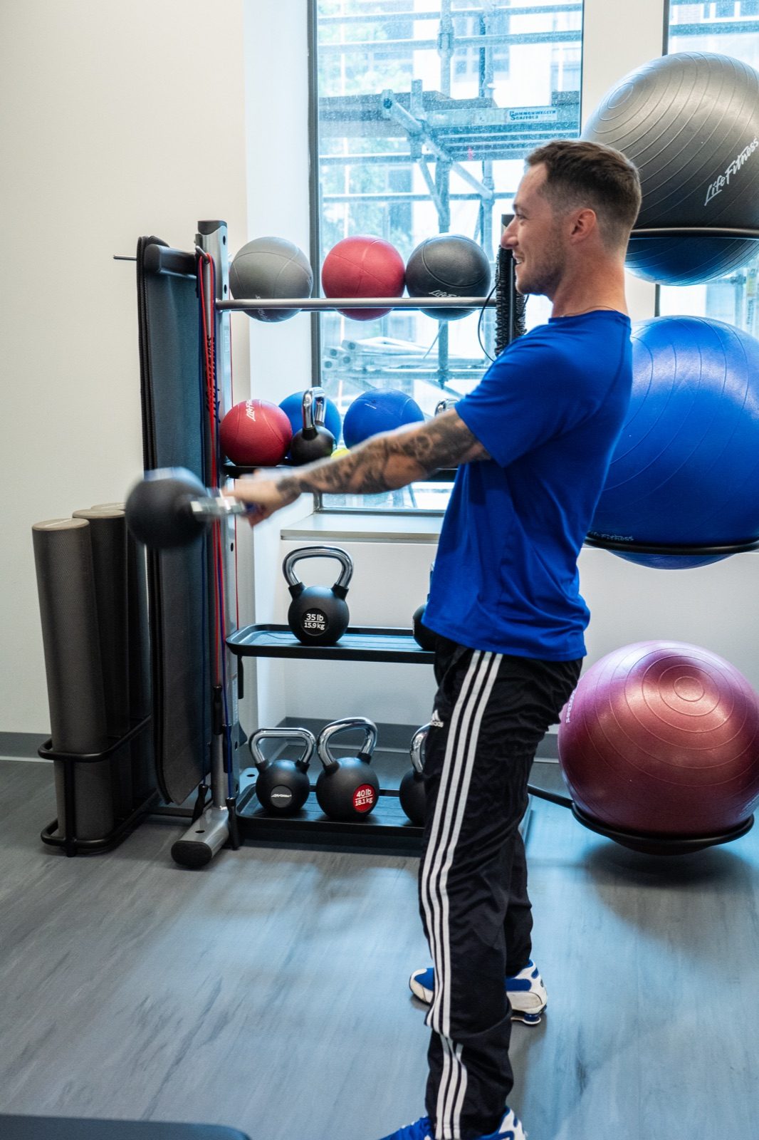 A certified First Fitness Management trainer coaching a workout